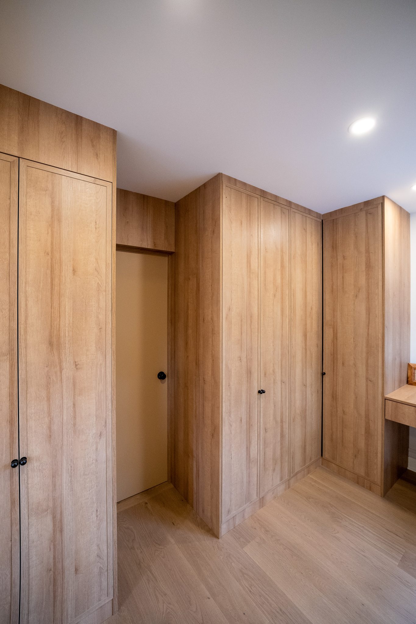 Custom oak wardrobe wall, High Park renovation, Toronto