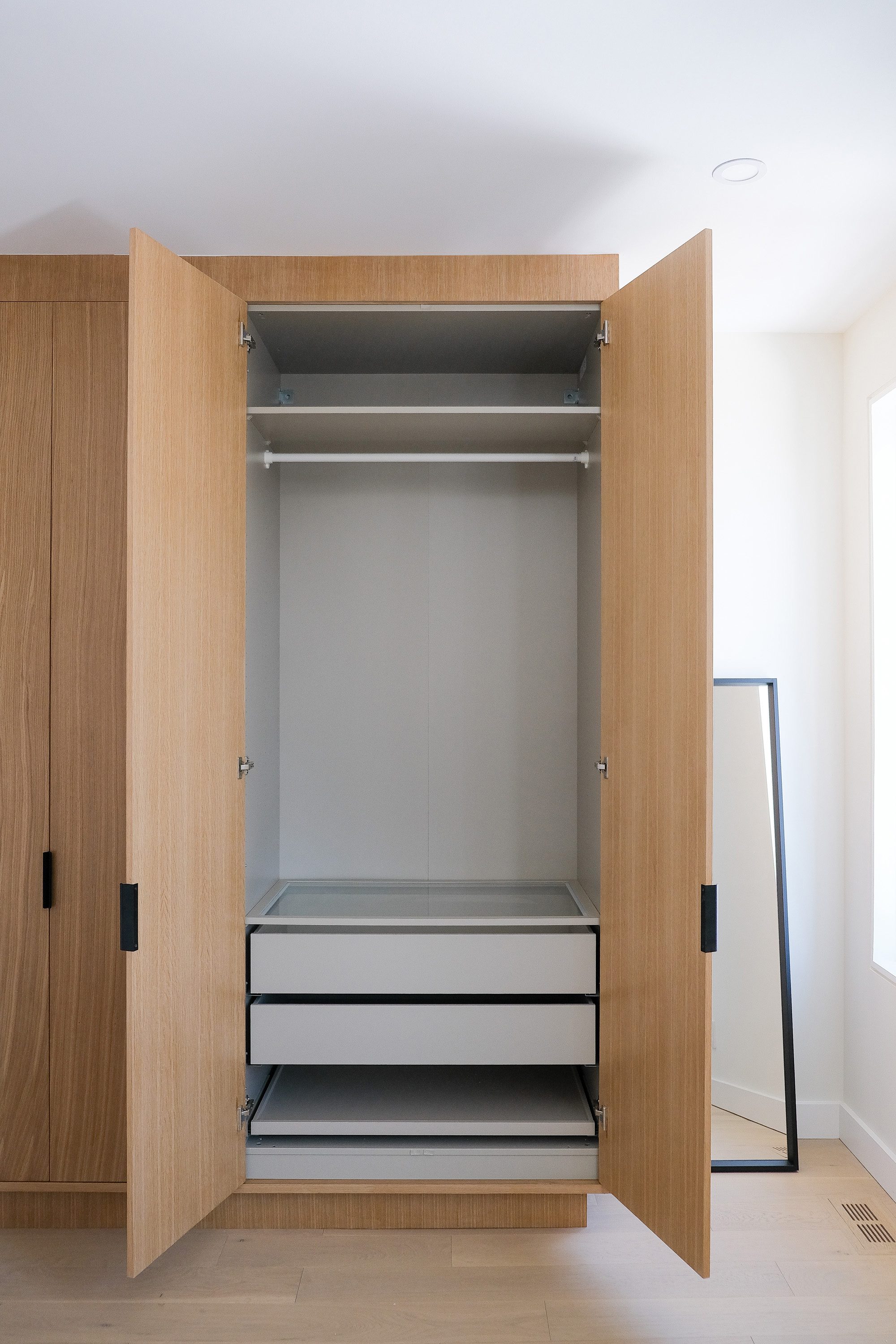 Custom bedroom storage millwork at Junction House, Toronto